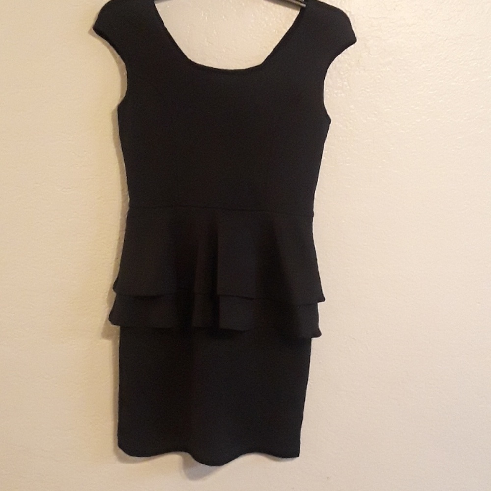 Peplum black dress. Curve flattering and adorable!